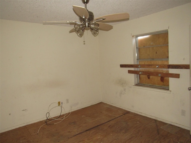 1221 Chestnut St, Waco, TX 76704 - spare room with wood finished floors, a ceiling fan, and a textured ceiling