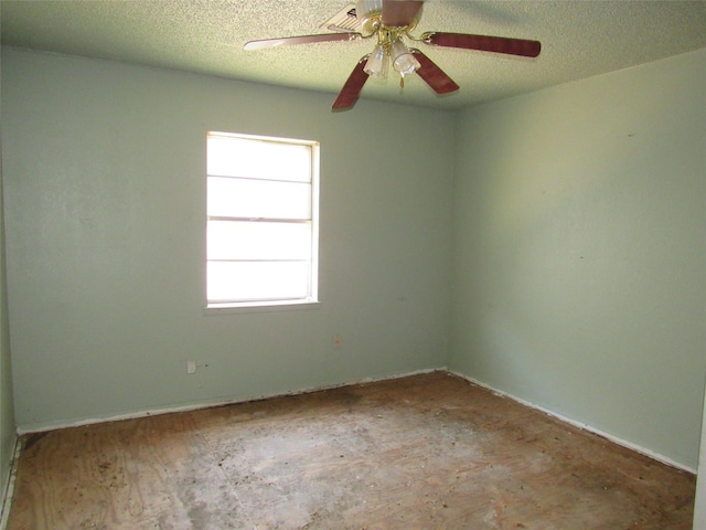 1221 Chestnut St, Waco, TX 76704 - empty room with a textured ceiling, ceiling fan, and baseboards