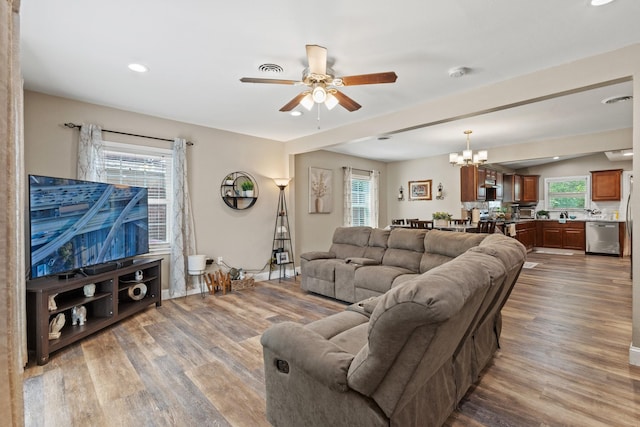 3607 Cortez Dr, Dallas, TX 75220 - living area with ceiling fan, wood finished floors, a chandelier, and recessed lighting