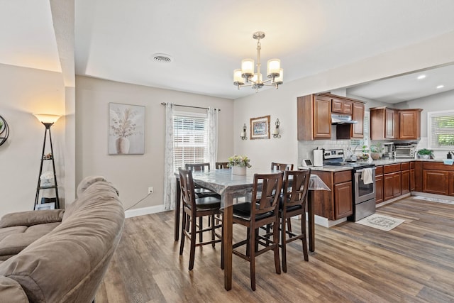3607 Cortez Dr, Dallas, TX 75220 - dining area featuring dark wood-style flooring, a chandelier, baseboards, and recessed lighting