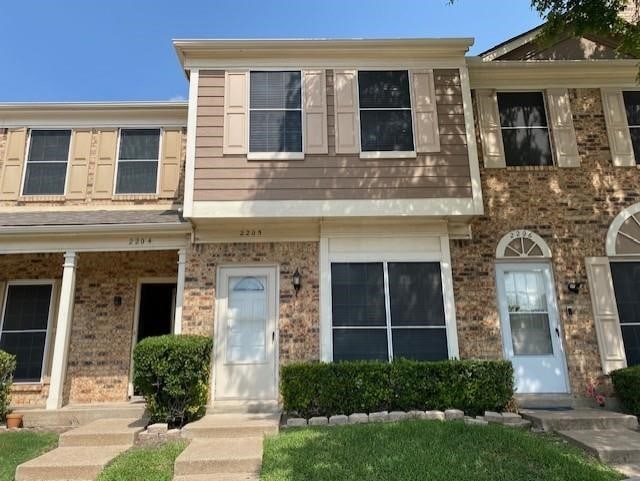 3801 14th St Unit 2205, Plano, TX 75074 - view of property featuring brick siding