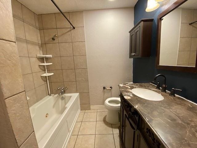3801 14th St Unit 2205, Plano, TX 75074 - bathroom with tile patterned flooring, washtub / shower combination, vanity, toilet, and baseboards