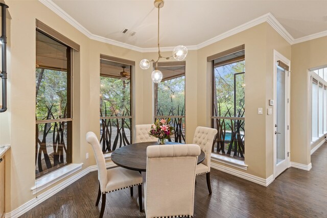 3206 Wintergreen Ter, Grapevine, TX 76051 - dining area featuring dark wood finished floors, plenty of natural light, baseboards, and crown molding