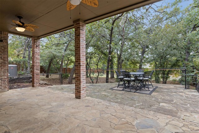 3206 Wintergreen Ter, Grapevine, TX 76051 - view of patio featuring a ceiling fan, outdoor dining space, central AC unit, and view of wooded area