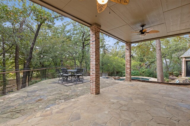 3206 Wintergreen Ter, Grapevine, TX 76051 - view of patio / terrace featuring a ceiling fan, a jacuzzi, outdoor dining area, and view of wooded area