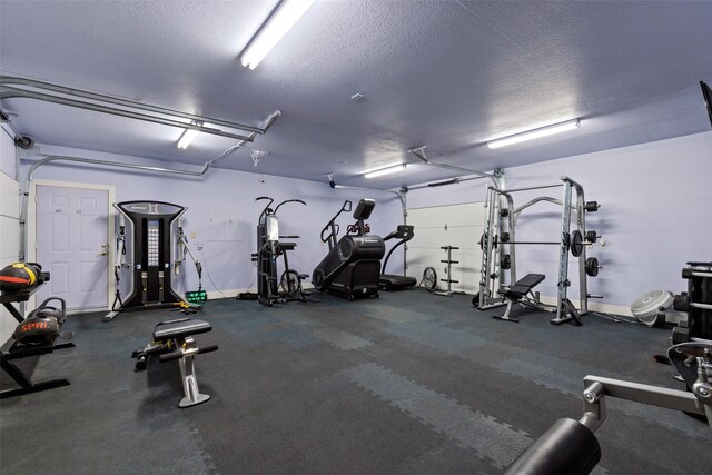3206 Wintergreen Ter, Grapevine, TX 76051 - gym featuring a textured ceiling