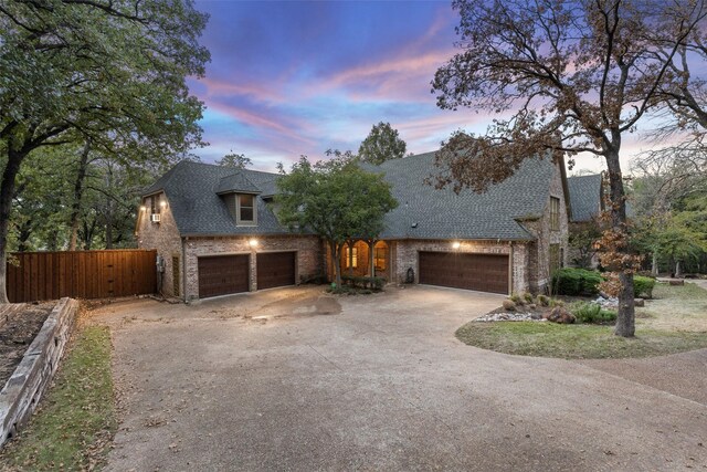 3206 Wintergreen Ter, Grapevine, TX 76051 - view of front of property featuring driveway, brick siding, and roof with shingles