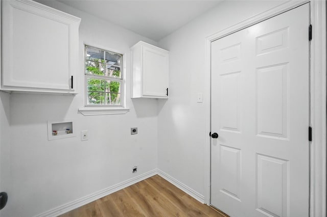400 Baldwin Dr, Joshua, TX 76058 - laundry area with electric dryer hookup, baseboards, cabinet space, wood finished floors, and hookup for a washing machine