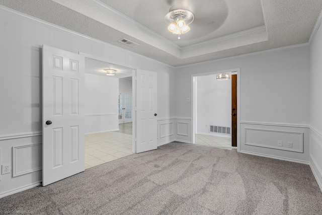 2810 Live Oak Dr, Rowlett, TX 75088 - unfurnished bedroom featuring carpet, ornamental molding, a decorative wall, tile patterned flooring, and a wainscoted wall