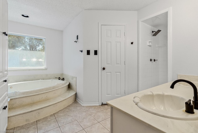2810 Live Oak Dr, Rowlett, TX 75088 - bathroom featuring a textured ceiling, a bath, tiled shower, tile patterned floors, and vanity
