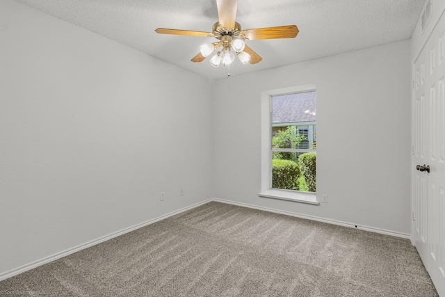 2810 Live Oak Dr, Rowlett, TX 75088 - carpeted spare room featuring ceiling fan, baseboards, and a textured ceiling