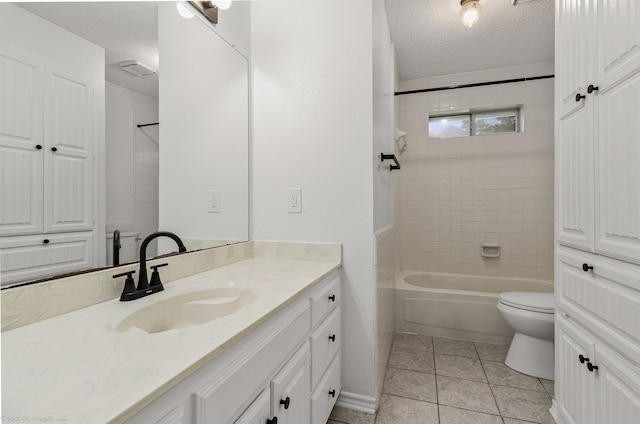 2810 Live Oak Dr, Rowlett, TX 75088 - full bath with a textured ceiling, toilet, vanity, tile patterned floors, and bathtub / shower combination