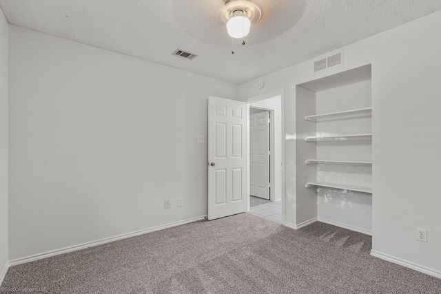 2810 Live Oak Dr, Rowlett, TX 75088 - unfurnished bedroom featuring carpet floors, a textured ceiling, ceiling fan, and baseboards