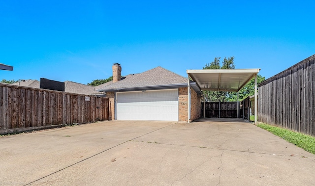 2810 Live Oak Dr, Rowlett, TX 75088 - view of property exterior featuring driveway, brick siding, a chimney, and a shingled roof