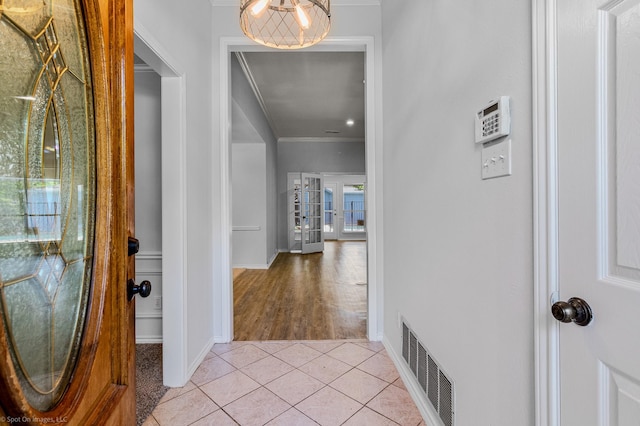 2810 Live Oak Dr, Rowlett, TX 75088 - entrance foyer with ornamental molding, baseboards, light tile patterned floors, and french doors