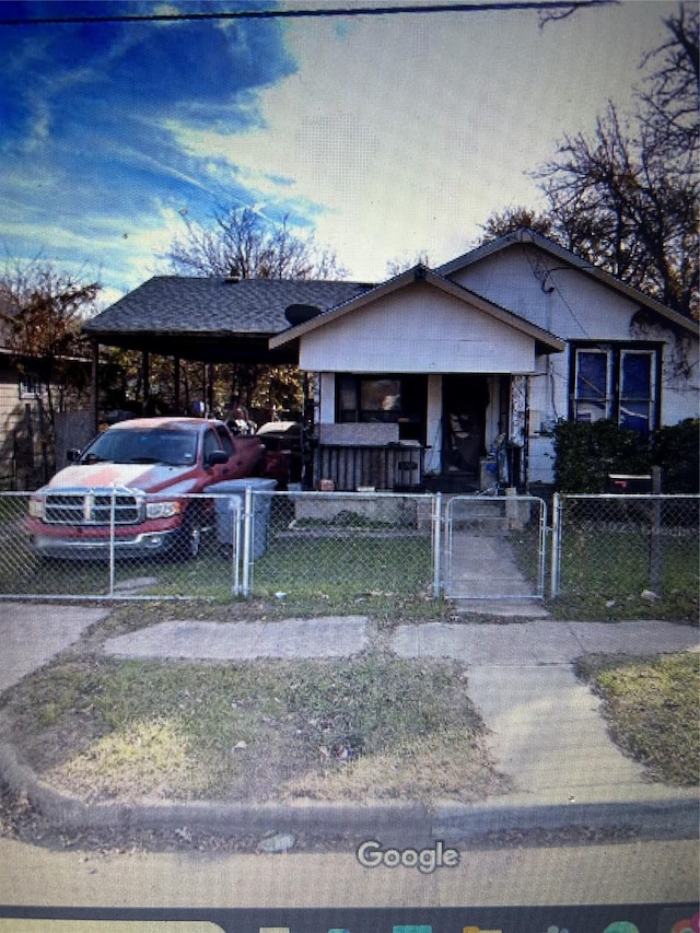 1846 Angelina Dr, Dallas, TX 75212 - bungalow-style home with a porch, a gate, a fenced front yard, and an attached carport