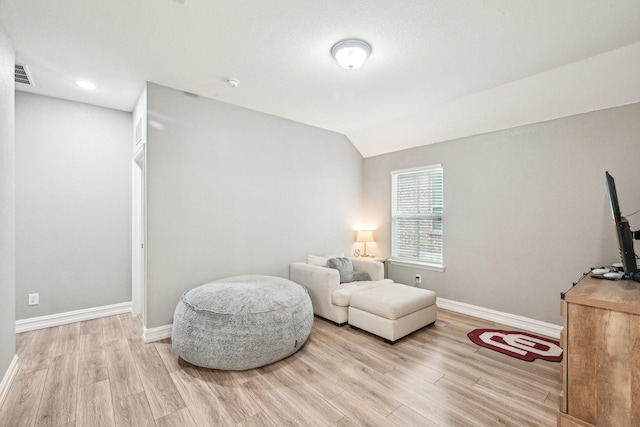 3613 Texas Dall Ct, Mckinney, TX 75071 - living area featuring wood finished floors and vaulted ceiling
