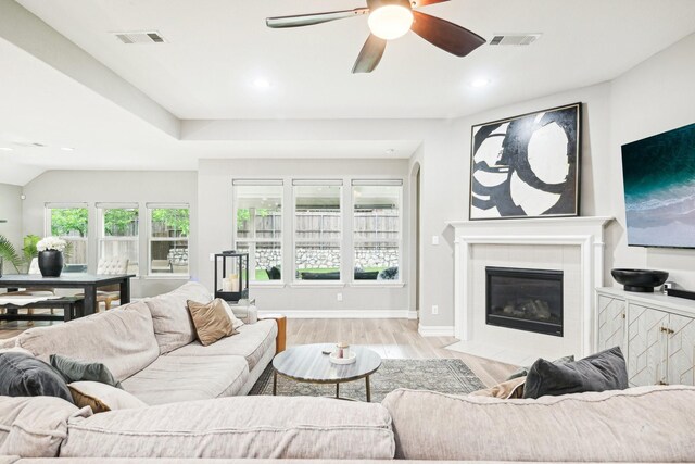 3613 Texas Dall Ct, Mckinney, TX 75071 - living room featuring recessed lighting, ceiling fan, light wood-type flooring, and a glass covered fireplace