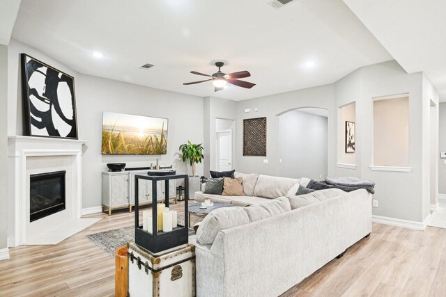 3613 Texas Dall Ct, Mckinney, TX 75071 - living room featuring light wood-style flooring, ceiling fan, recessed lighting, and a tile fireplace