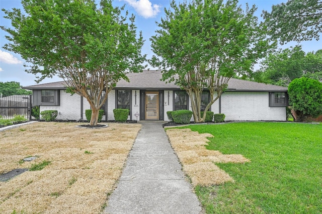 1425 Cassandra Cir, Desoto, TX 75115 - view of front of house featuring brick siding and roof with shingles
