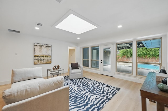 1425 Cassandra Cir, Desoto, TX 75115 - living room featuring a skylight, wood finished floors, and recessed lighting