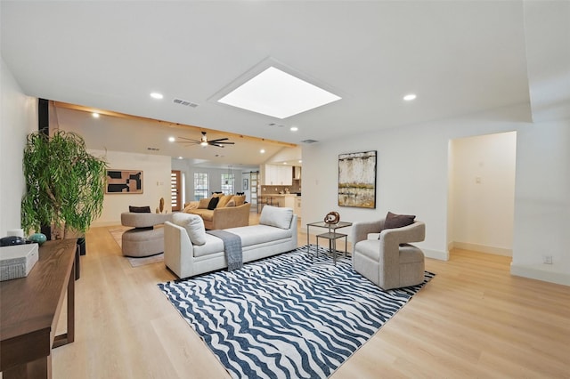 1425 Cassandra Cir, Desoto, TX 75115 - living room featuring a skylight, light wood finished floors, recessed lighting, baseboards, and a ceiling fan