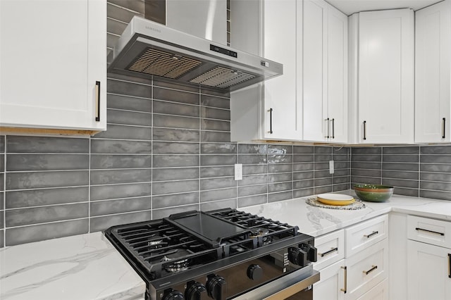 1425 Cassandra Cir, Desoto, TX 75115 - kitchen with exhaust hood, gas stove, white cabinetry, backsplash, and light stone countertops