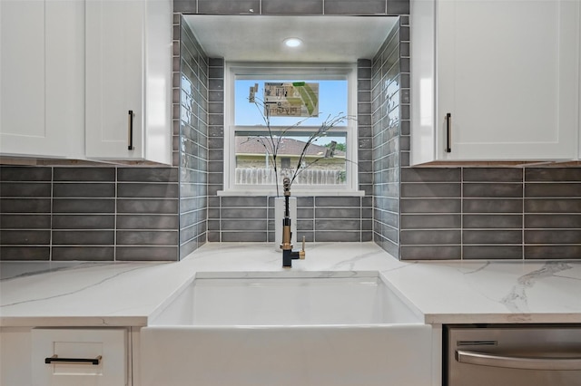 1425 Cassandra Cir, Desoto, TX 75115 - kitchen view of dishwasher, a sink, white cabinetry, and decorative backsplash