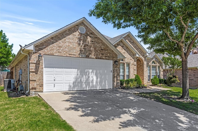4824 Carolina Trace Trl, Fort Worth, TX 76244 - view of front of house featuring an attached garage, driveway, central AC, and brick siding