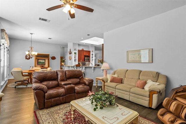 4824 Carolina Trace Trl, Fort Worth, TX 76244 - living room with a chandelier, dark wood-style flooring, ceiling fan, and baseboards
