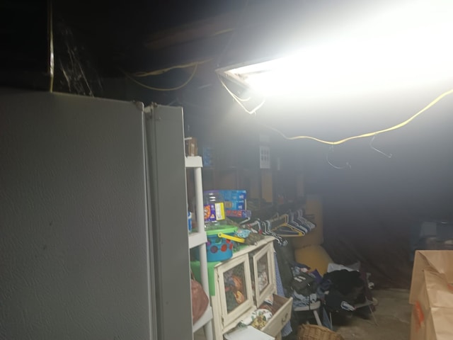 1123 Gilliam St, Bellmead, TX 76705 - below grade area featuring freestanding refrigerator