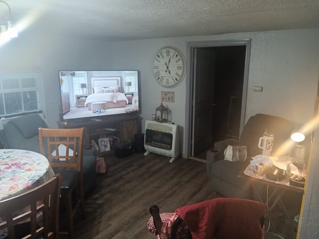 1123 Gilliam St, Bellmead, TX 76705 - living area featuring heating unit, wood finished floors, and a textured ceiling