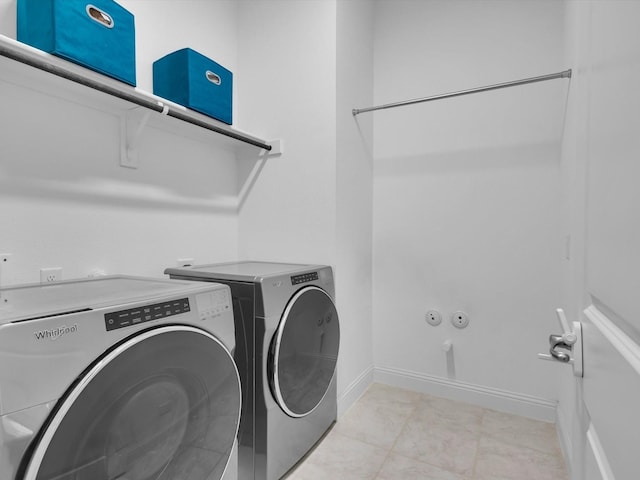 8620 Bandon Dunes Dr, Mckinney, TX 75070 - laundry area with washer and clothes dryer and baseboards