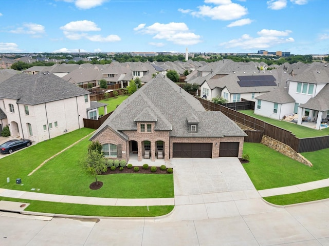 8620 Bandon Dunes Dr, Mckinney, TX 75070 - view of front of property with brick siding, a residential view, driveway, roof with shingles, and an attached garage