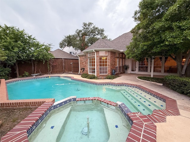 7100 Deer Run, Plano, TX 75024 - view of pool with a pool with connected hot tub and a fenced backyard