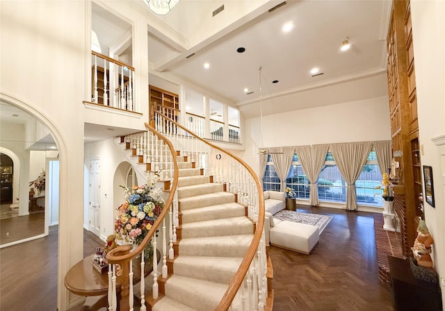 7100 Deer Run, Plano, TX 75024 - staircase featuring a high ceiling and arched walkways