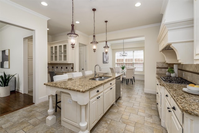 1814 Trinidad Ln, Allen, TX 75013 - kitchen with a sink, stone tile floors, stainless steel appliances, baseboards, and a center island with sink