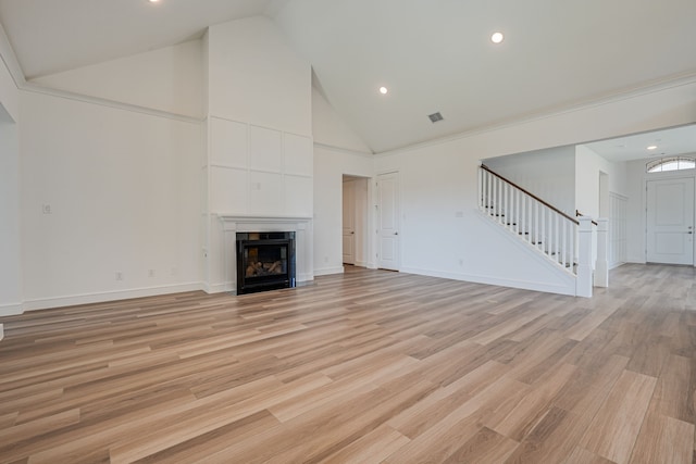 4005 Hollandwood Dr, Mckinney, TX 75071 - unfurnished living room featuring high vaulted ceiling, stairs, recessed lighting, baseboards, and light wood finished floors