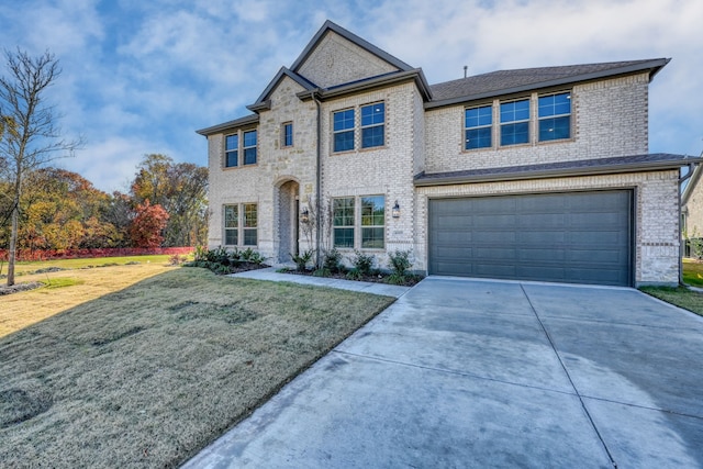 4005 Hollandwood Dr, Mckinney, TX 75071 - view of front facade featuring driveway, a garage, a front yard, and brick siding