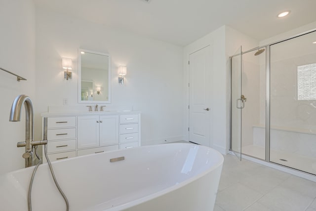 4005 Hollandwood Dr, Mckinney, TX 75071 - bathroom featuring a shower stall, a freestanding tub, tile patterned flooring, vanity, and recessed lighting