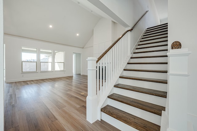 4005 Hollandwood Dr, Mckinney, TX 75071 - stairway with high vaulted ceiling, wood finished floors, recessed lighting, and baseboards