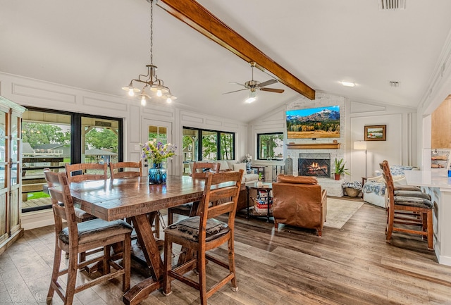 2012 Island Cir, Tool, TX 75143 - dining space with light wood-type flooring, ceiling fan, and a stone fireplace