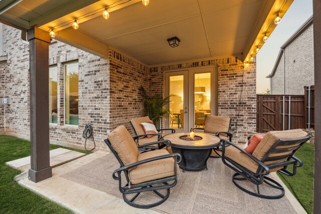 14326 Sedgegrass Dr, Frisco, TX 75033 - view of patio / terrace featuring a fire pit and french doors