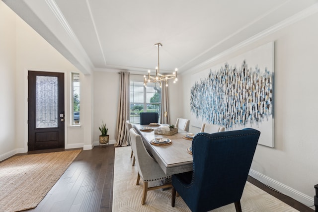 14326 Sedgegrass Dr, Frisco, TX 75033 - dining room with a chandelier, baseboards, wood finished floors, and crown molding