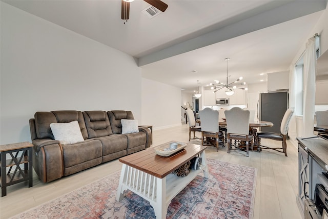 3044 Wind Knot Way, Royse City, TX 75189 - living area with ceiling fan, a chandelier, and light wood-style flooring