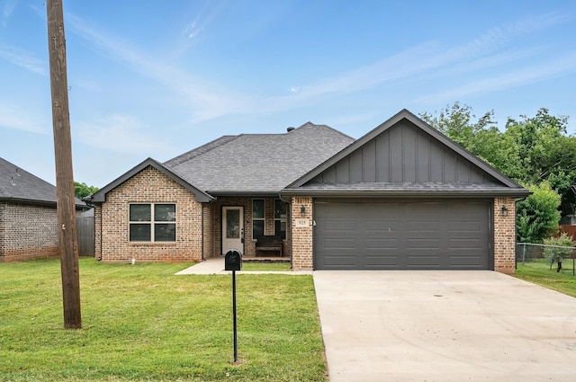 925 8th St, Tuscola, TX 79562 - view of front of house with an attached garage, board and batten siding, concrete driveway, brick siding, and a shingled roof