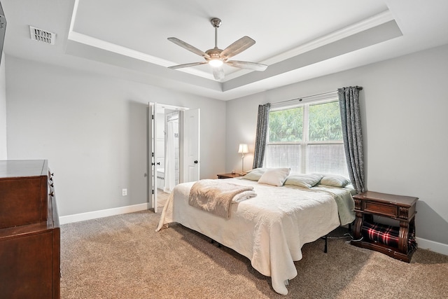 925 8th St, Tuscola, TX 79562 - bedroom with a tray ceiling, light colored carpet, baseboards, ornamental molding, and a ceiling fan