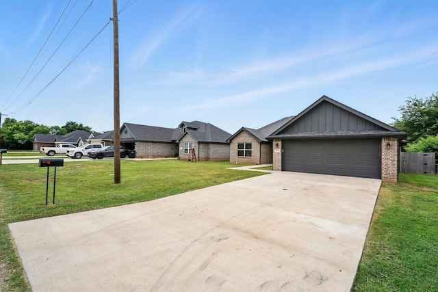 925 8th St, Tuscola, TX 79562 - view of front of house with board and batten siding, brick siding, driveway, a front lawn, and a garage