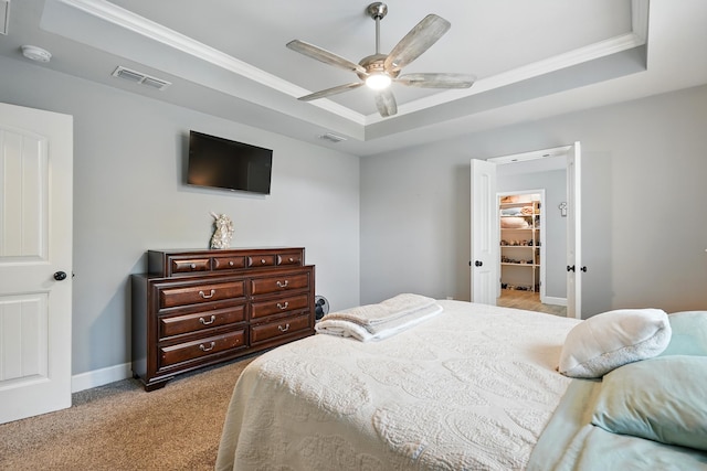 925 8th St, Tuscola, TX 79562 - carpeted bedroom with a tray ceiling, crown molding, baseboards, and ceiling fan