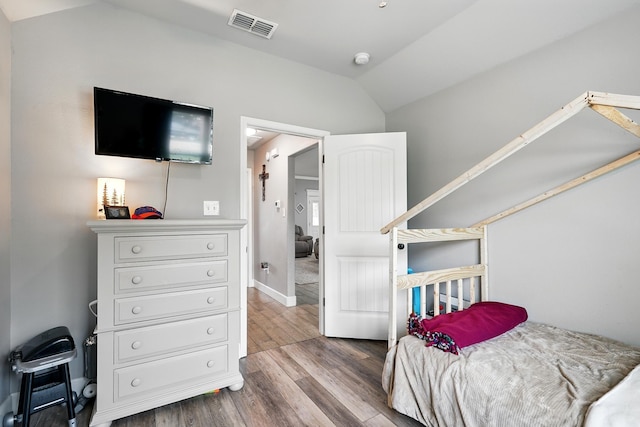 925 8th St, Tuscola, TX 79562 - bedroom with vaulted ceiling and wood finished floors